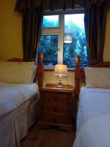 Voodi või voodid majutusasutuse Corrib View Guesthouse h91rr72 toas