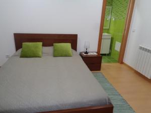 Ένα ή περισσότερα κρεβάτια σε δωμάτιο στο Charrua do Mondego - Alojamento Local