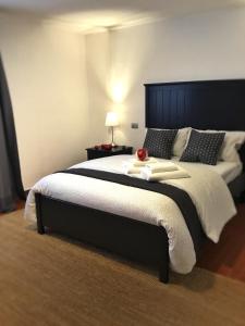a bedroom with a large bed with a fruit on it at Casa del Vigneto - NEW near VENICE - rooms+bathroom - INDEPENDENT in Spinea