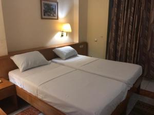 Posteľ alebo postele v izbe v ubytovaní Maple Leaf Korean Hotel
