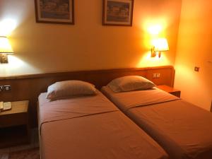 Posteľ alebo postele v izbe v ubytovaní Maple Leaf Korean Hotel
