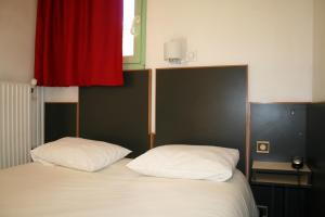 Letto o letti in una camera di Hôtel La Chartreuse
