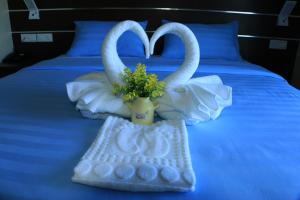 Letto o letti in una camera di Wave View Hotel