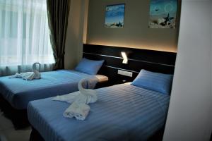 Letto o letti in una camera di Wave View Hotel