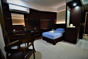 Letto o letti in una camera di Wave View Hotel