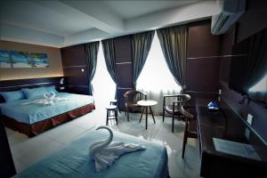 Letto o letti in una camera di Wave View Hotel