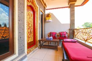 Balkón nebo terasa v ubytování Jungut Guest House Ubud