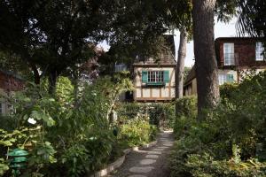 a garden path in front of a house at The Charlie West Hollywood in Los Angeles