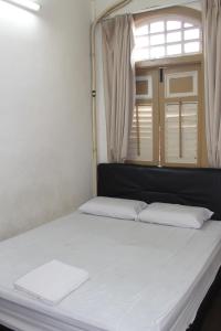 Postel nebo postele na pokoji v ubytování Old Penang Hotel - Trang Road