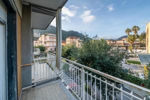 a balcony with a view of a city at Finalmarina Centro 2 in Finale Ligure