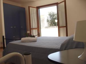 מיטה או מיטות בחדר ב-Residence Favonio