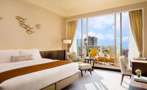 A bed or beds in a room at Hong Kong Gold Coast Hotel