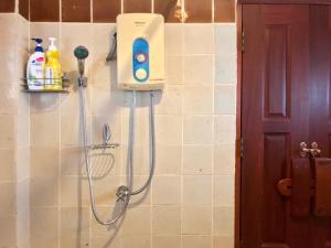 a shower in a bathroom with a shower head at Kawila126 in Chiang Mai