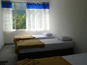 Ένα ή περισσότερα κρεβάτια σε δωμάτιο στο White House Riverside Retreat