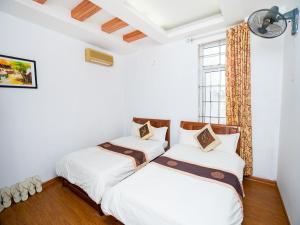 Voodi või voodid majutusasutuse Phuong Dong hotel toas