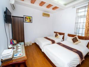 Voodi või voodid majutusasutuse Phuong Dong hotel toas