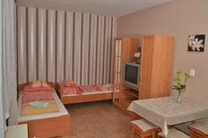 Voodi või voodid majutusasutuse Homokháti Apartman toas