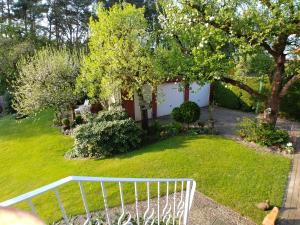 a view of a yard with a white fence at Haus Spengler in Celle