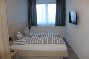 Postel nebo postele na pokoji v ubytování Hotel Lumi