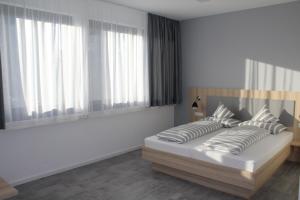 Postel nebo postele na pokoji v ubytování Hotel Lumi