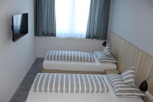 Postel nebo postele na pokoji v ubytování Hotel Lumi