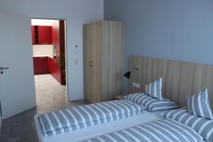 Postel nebo postele na pokoji v ubytování Hotel Lumi