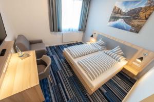 Postel nebo postele na pokoji v ubytování Hotel Lumi