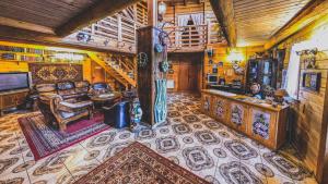 a living room with a couch and a table at 12 Months Estate in Myslovka