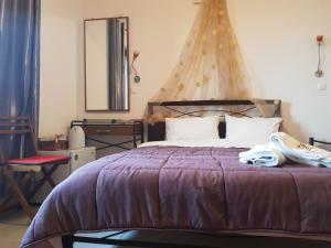 Ένα ή περισσότερα κρεβάτια σε δωμάτιο στο Petra & Elato Art Hotel