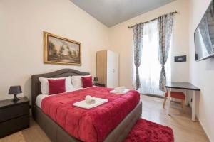 Un pat sau paturi într-o cameră la Via Umberto
