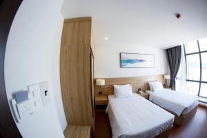 Postel nebo postele na pokoji v ubytování LiLy Apartment