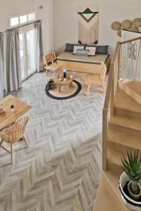 a living room with a couch and a table at Kalimera Karpathos Exclusive Villas in Afiartis