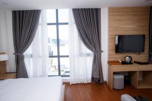 Postel nebo postele na pokoji v ubytování LiLy Apartment