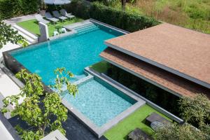 an overhead view of a swimming pool in a backyard at The Glory Gold in Khao Lak