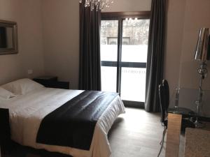 Łóżko lub łóżka w pokoju w obiekcie Alvear Suites