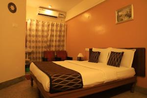 Un pat sau paturi într-o cameră la TM Hotel