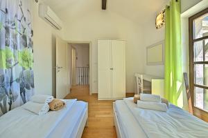 Posteľ alebo postele v izbe v ubytovaní Luxury Stone Villa Zanelli