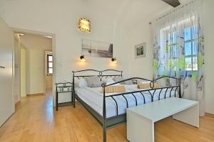 Posteľ alebo postele v izbe v ubytovaní Luxury Stone Villa Zanelli