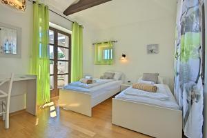 Posteľ alebo postele v izbe v ubytovaní Luxury Stone Villa Zanelli