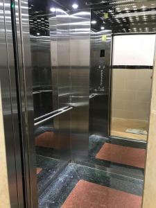 a stainless steel refrigerator in a room at Hotel Hoai Anh in Vung Tau