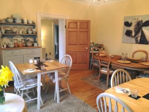 a kitchen and dining room with a table and chairs at Lanercost Country B&B in Brampton