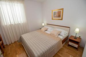 Postel nebo postele na pokoji v ubytování Villa Noa Mimice