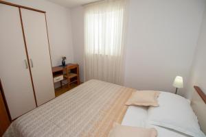 Postel nebo postele na pokoji v ubytování Villa Noa Mimice