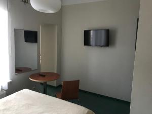 TV a/nebo společenská místnost v ubytování Hommiku Guesthouse