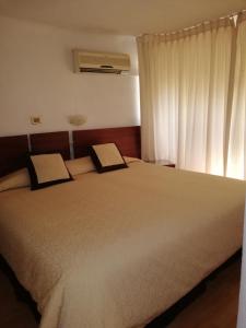 Letto o letti in una camera di Hotel Montecarlo Santiago
