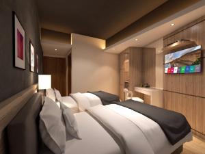 Postel nebo postele na pokoji v ubytování Grand Hallmark Hotel - Johor Bahru