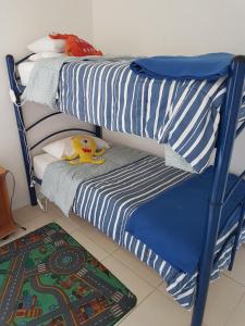 Un pat sau paturi într-o cameră la Departamento en Lomas de Papudo II