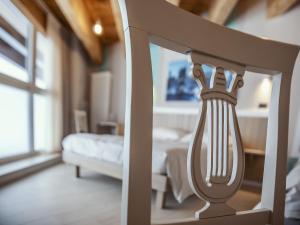 Posteľ alebo postele v izbe v ubytovaní Hotel Laghetto