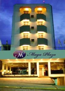 a large building with a sign in front of it at MAGA PLAZA HOTEL in São José do Rio Pardo