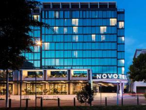 a large building with a clock on the front of it at Novotel Brisbane South Bank in Brisbane